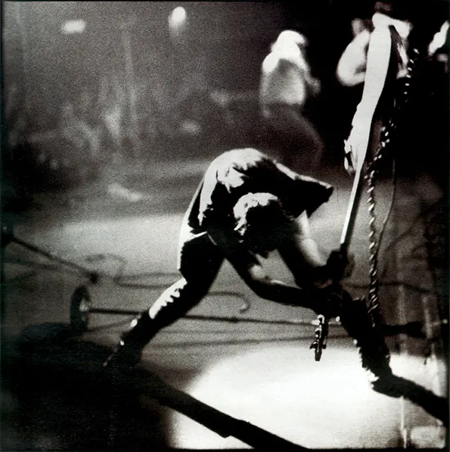 Paul Simonon smashing his guitar